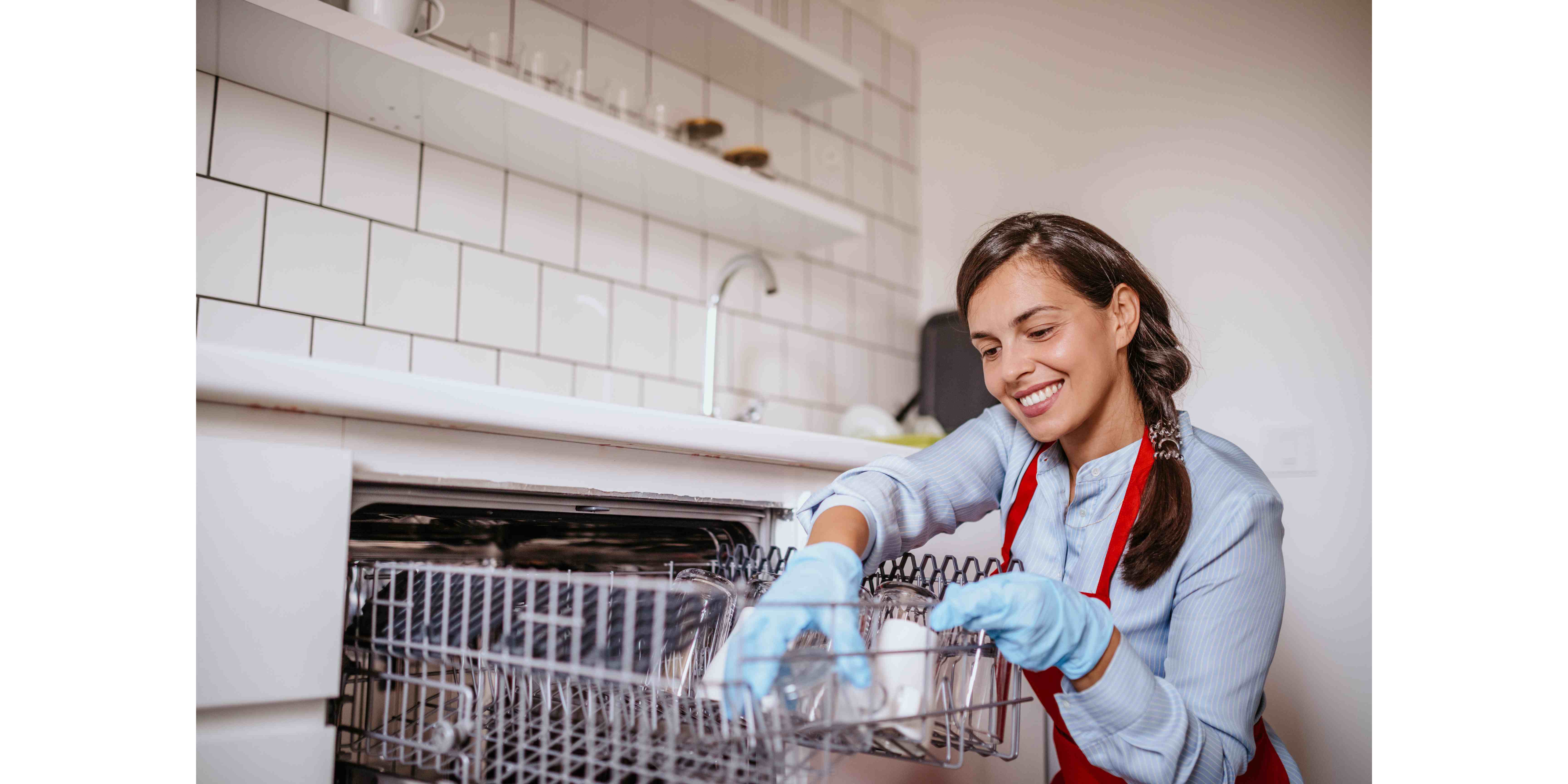 cleaning lady loading dishwasher
