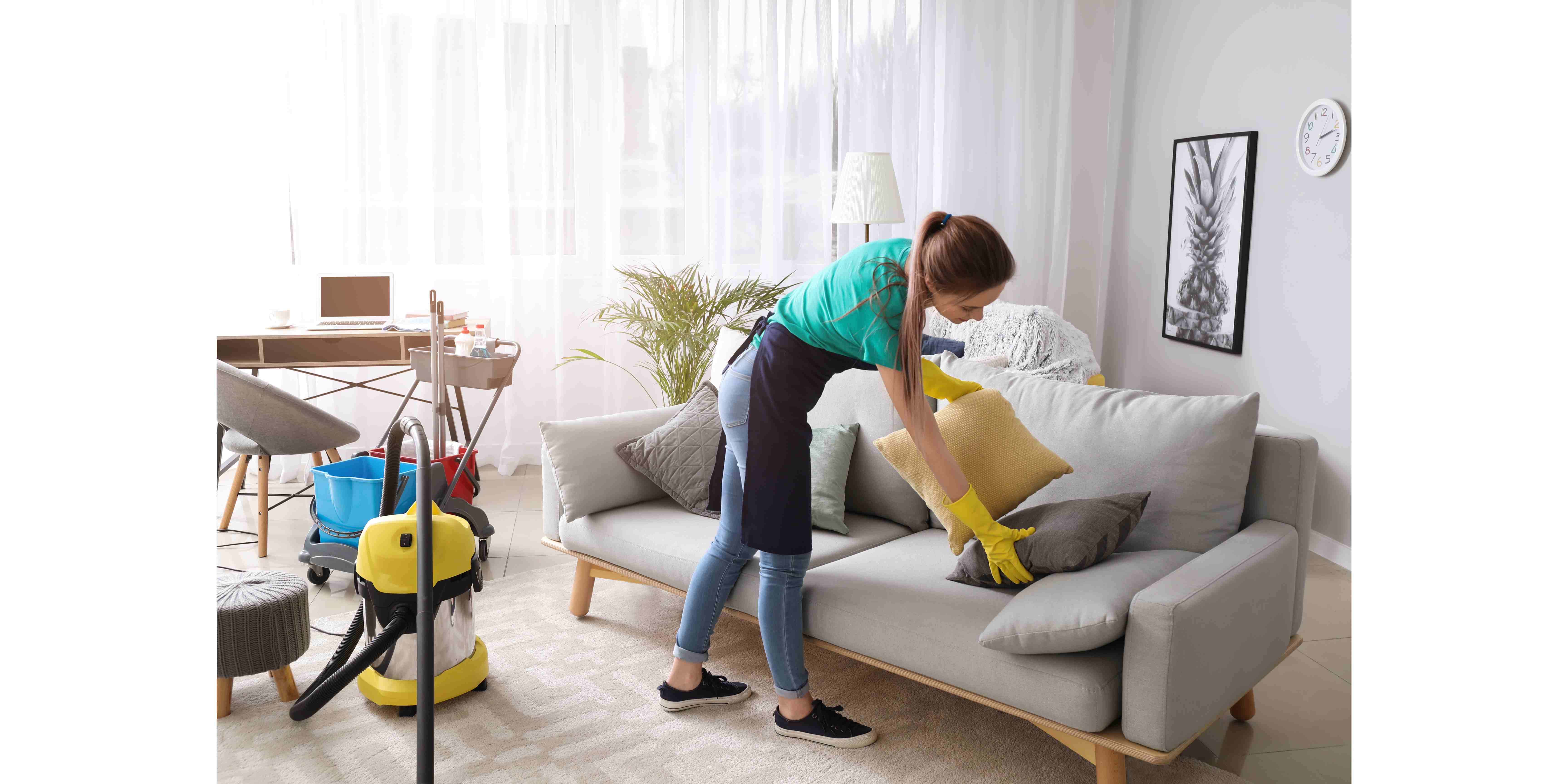 female janitor cleaning room