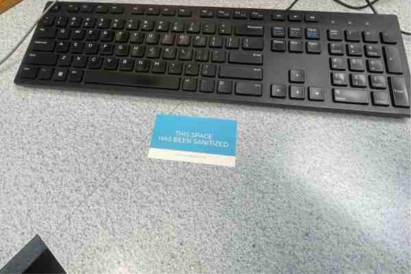 a card that says "this space has been sanitized"