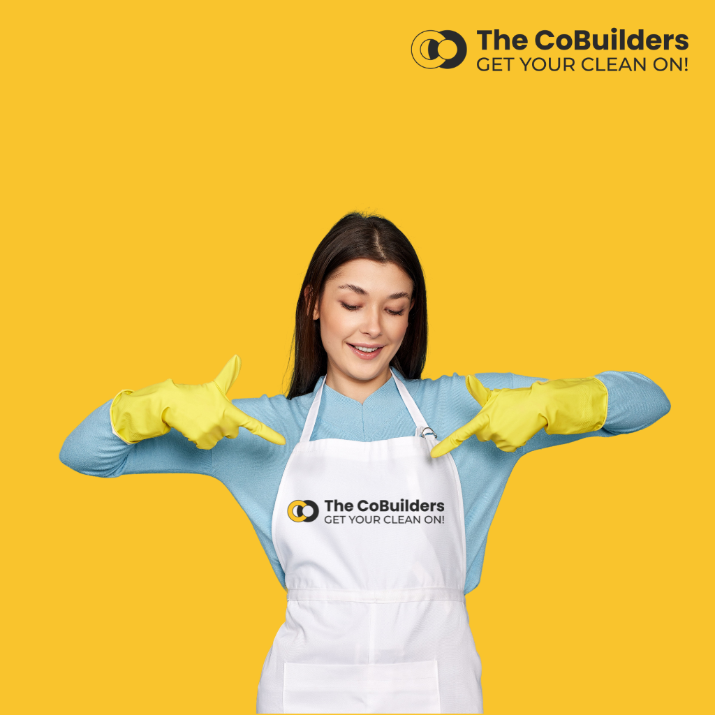 picture of a female cleaner wearing apron with the cobuilders logo