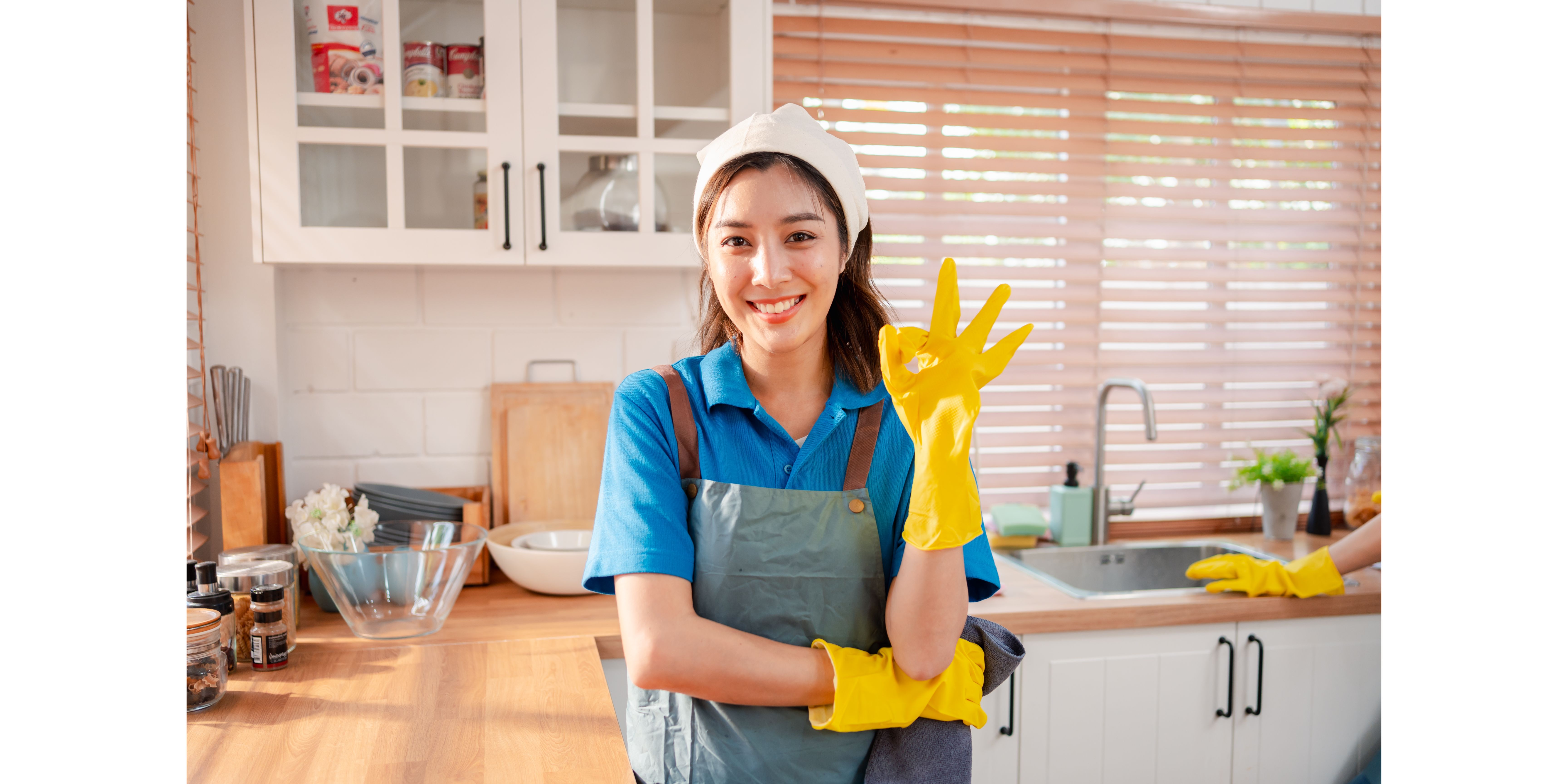 female cleaner cleaning a kitchen
