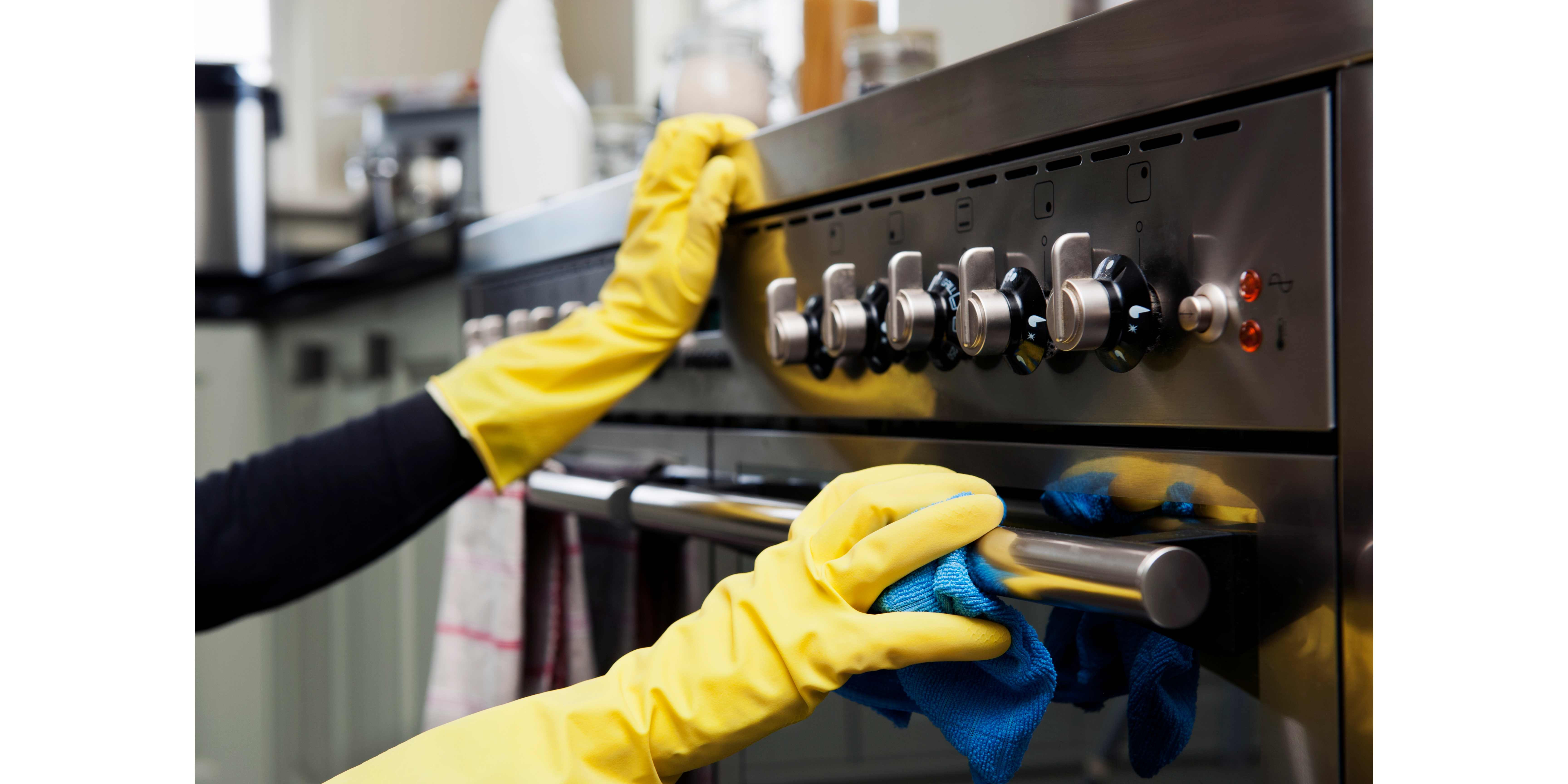 cleaner cleaning an oven