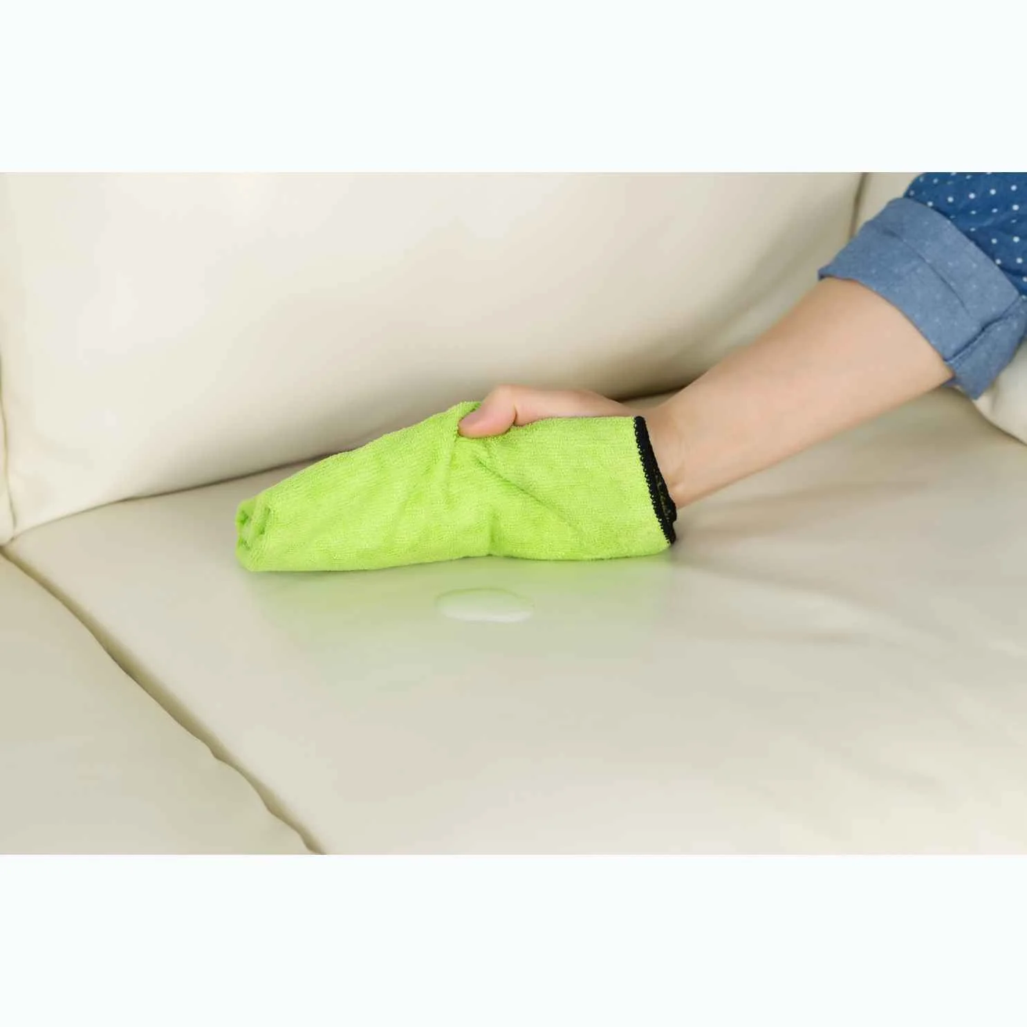 house cleaner cleaning a leather chair