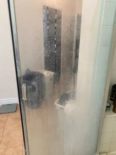 Shower glass with hard water stains